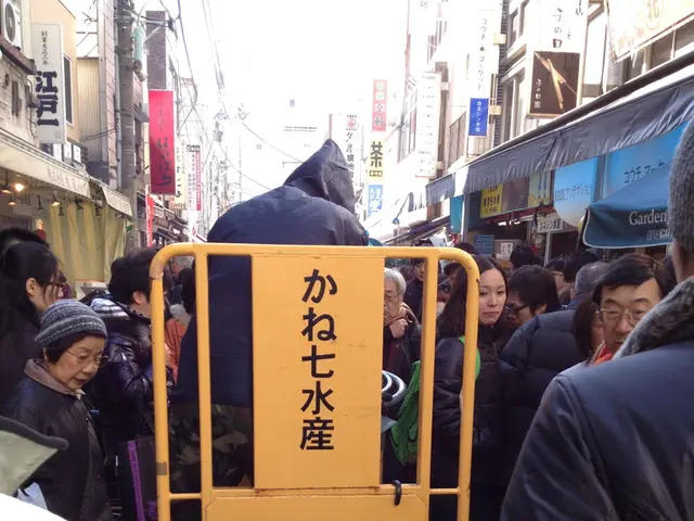 Here we can see people and board. Background there are buildings and hoarding. These people wore...