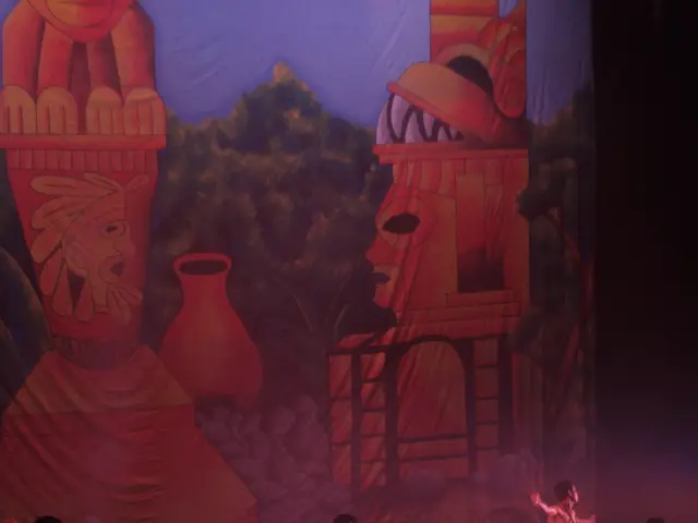 In this image we can see people wearing costumes and performing on the dais. In the background...