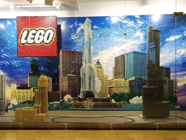 In this image we can see crafts made with legos. At the bottom there is a floor. In the background...