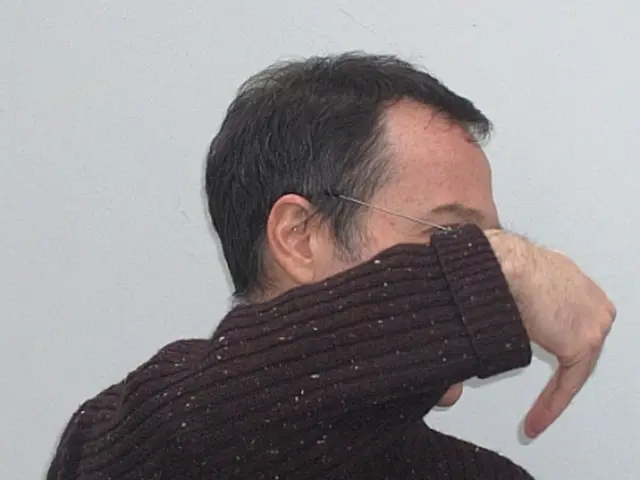 In this image I can see a person wearing a woolen sweater and background is white.